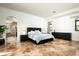 Spacious main bedroom with tiled floors, ensuite bath, and a neutral color palette at 22022 N Calle Royale Dr, Scottsdale, AZ 85255