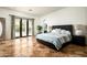 Main bedroom featuring tiled floors, backyard access, and an ensuite bath at 22022 N Calle Royale Dr, Scottsdale, AZ 85255