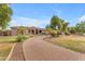 Long driveway to beautiful house with lush mature landscaping at 2285 E Plum St, Gilbert, AZ 85298