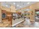 Spacious open kitchen with stainless steel appliances, island, and backyard views at 2285 E Plum St, Gilbert, AZ 85298