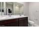 Bright bathroom boasts double sinks, modern fixtures, and a neutral color palette at 22895 N 183Rd Dr, Surprise, AZ 85387