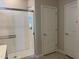 Bright bathroom with a modern glass shower and neutral finishes at 22895 N 183Rd Dr, Surprise, AZ 85387