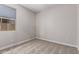 This bedroom features carpet floors, neutral colored walls, and a window with a view at 22895 N 183Rd Dr, Surprise, AZ 85387