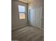 Bright bedroom with closet and window at 22895 N 183Rd Dr, Surprise, AZ 85387