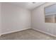 This carpeted bedroom has a window with a view to the outside at 22895 N 183Rd Dr, Surprise, AZ 85387