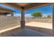 Covered patio area offers an inviting space for outdoor relaxation and entertainment at 22895 N 183Rd Dr, Surprise, AZ 85387