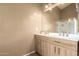 Bright bathroom featuring a large mirror, and and sinks at 23613 W Mobile Ln, Buckeye, AZ 85326