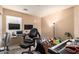 Spacious bedroom featuring two monitors, a comfortable chair and an electric piano at 23613 W Mobile Ln, Buckeye, AZ 85326