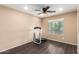 Neutral living room featuring a ceiling fan, and a window at 23613 W Mobile Ln, Buckeye, AZ 85326