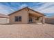 Spacious backyard featuring a covered patio, ideal for outdoor relaxation and entertaining at 2518 W Carson Rd, Phoenix, AZ 85041