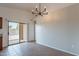 Eating area with sliding door and a modern chandelier at 2518 W Carson Rd, Phoenix, AZ 85041