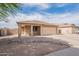 Inviting single-story home featuring a desert landscape front yard and a convenient two-car garage at 2518 W Carson Rd, Phoenix, AZ 85041