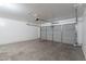 Spacious two-car garage with roll up door and concrete floor at 2518 W Carson Rd, Phoenix, AZ 85041