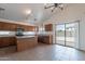 Open kitchen with an island, stainless steel appliances, and sliding door access to the backyard at 2518 W Carson Rd, Phoenix, AZ 85041