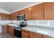 Bright kitchen features granite countertops, stainless steel appliances, and plenty of cabinet space at 2518 W Carson Rd, Phoenix, AZ 85041