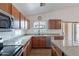 Kitchen features stainless steel appliances, granite countertops, and plenty of natural light at 2518 W Carson Rd, Phoenix, AZ 85041