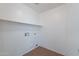 A utility room offers open shelving and tile flooring at 2518 W Carson Rd, Phoenix, AZ 85041