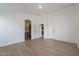 Main bedroom has hard surface floors and doorways to the bathroom and kitchen at 2518 W Carson Rd, Phoenix, AZ 85041