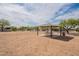 Community park picnic area featuring a shade structure and mature trees for comfortable outdoor activities at 2518 W Carson Rd, Phoenix, AZ 85041