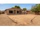 Expansive backyard featuring a covered patio area, perfect for outdoor entertaining and relaxation at 2590 S Buckaroo Trl, Gilbert, AZ 85295