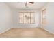Bright bedroom with a ceiling fan and natural light at 2590 S Buckaroo Trl, Gilbert, AZ 85295