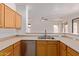 Spacious kitchen with wood cabinets and stainless-steel appliances at 2590 S Buckaroo Trl, Gilbert, AZ 85295