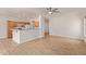 Bright open-concept living space featuring wood floors and direct access to the kitchen at 2590 S Buckaroo Trl, Gilbert, AZ 85295