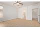 Main bedroom with en suite bathroom, ceiling fan, and natural light at 2590 S Buckaroo Trl, Gilbert, AZ 85295