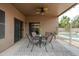 Inviting covered back patio with a table and chairs, perfect for outdoor dining and relaxation at 2834 E Devon Ct, Gilbert, AZ 85296