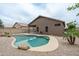 Backyard featuring a refreshing pool and landscaping offering a private outdoor space at 2834 E Devon Ct, Gilbert, AZ 85296