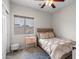 Cozy bedroom showcasing a comfortable bed, side table, and a window providing natural light at 2834 E Devon Ct, Gilbert, AZ 85296