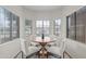 Inviting breakfast nook with a round table, four chairs, and lots of natural light at 2834 E Devon Ct, Gilbert, AZ 85296