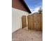Exterior view of a new wooden fence and rock landscaping at 3102 N Woodburne Dr, Chandler, AZ 85224