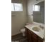 Bathroom featuring a vanity, sink, mirror, and a toilet at 3102 N Woodburne Dr, Chandler, AZ 85224