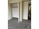 Carpeted bedroom with bi-fold closet at 3102 N Woodburne Dr, Chandler, AZ 85224