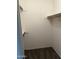 Carpeted walk-in closet with wooden shelving at 3102 N Woodburne Dr, Chandler, AZ 85224