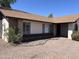 Charming single-story home featuring desert landscaping, brick accents and modern windows at 3102 N Woodburne Dr, Chandler, AZ 85224