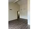 Spacious living room with vaulted ceilings, new flooring, and a modern light fixture at 3102 N Woodburne Dr, Chandler, AZ 85224