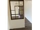 View of a living area leading to a dining room and den, featuring updated floors at 3102 N Woodburne Dr, Chandler, AZ 85224