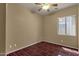 Sunlit bedroom featuring wood-look floors, ideal for a cozy retreat at 34944 N Mirandesa Dr, San Tan Valley, AZ 85143
