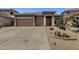 Charming single-story home with desert landscaping and a spacious three-car garage at 34944 N Mirandesa Dr, San Tan Valley, AZ 85143