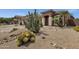 Desert landscaping featuring various cacti and rock accents, creating a low-maintenance front yard at 34944 N Mirandesa Dr, San Tan Valley, AZ 85143
