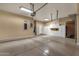 Organized garage with ample storage cabinets and overhead lighting at 34944 N Mirandesa Dr, San Tan Valley, AZ 85143