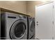 A laundry room with front load washer and dryer, and plenty of room at 34944 N Mirandesa Dr, San Tan Valley, AZ 85143