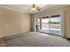 Living room features sliding glass doors to the pool and barbeque grill on the patio at 34944 N Mirandesa Dr, San Tan Valley, AZ 85143