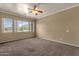 Spacious main bedroom with bright natural light from exterior windows at 34944 N Mirandesa Dr, San Tan Valley, AZ 85143