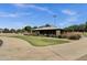Community picnic pavilion with stone columns, landscaped surroundings, and concrete path in a park setting at 34944 N Mirandesa Dr, San Tan Valley, AZ 85143