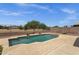 A serene backyard pool area with decorative fountains, desert landscape, and ample space at 34944 N Mirandesa Dr, San Tan Valley, AZ 85143