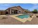 Beautiful pool and outdoor living area with covered patio, ideal for entertaining at 34944 N Mirandesa Dr, San Tan Valley, AZ 85143
