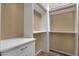 Organized walk-in closet with built-in shelves and drawers, maximizing storage space at 34944 N Mirandesa Dr, San Tan Valley, AZ 85143